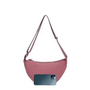 Dark pink nylon crescent bag with adjustable wide strap and smooth zipper closure