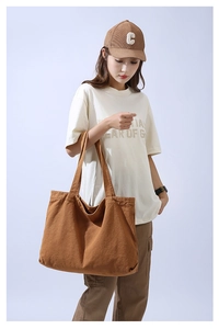 Brown corduroy tote bag detail showing large capacity design and casual fashion style