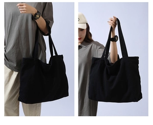 Dual view of a large black minimalist canvas tote bag showing shoulder and hand-carry styles