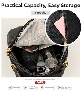 Detail view of black lychee leather bag with gold hardware and spacious interior storage