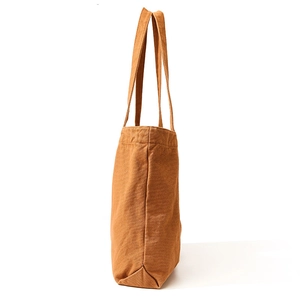 Minimalist caramel canvas tote bag with a spacious side-view design for women