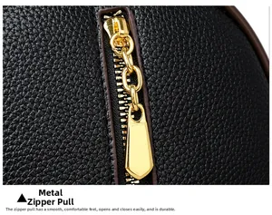 Detailed view of premium black lychee leather with high-quality golden metal zipper