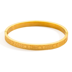 18k gold plated stainless steel bangle featuring engraved celestial sun moon and stars