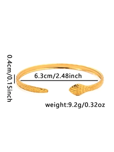 Detail showing snake scale texture and dimensions on a gold-plated stainless steel cuff