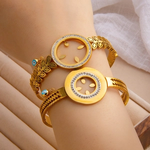 Golden evil eye charm bracelets with sparkling rhinestones and hollow leaf patterns