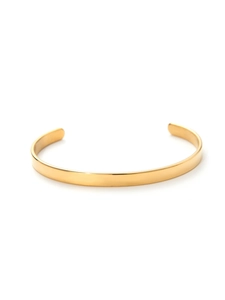 Close-up of polished 18k gold plated stainless steel C-shaped cuff bracelet for women