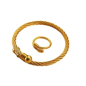 Gold twisted wire cuff bracelet and matching open ring set in punk hip hop style