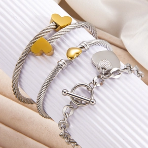 Three-piece gold and silver heart bracelet set with toggle clasp and pavé rhinestones