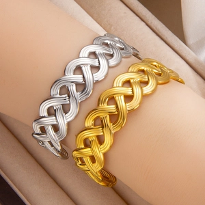 Minimalist 18k gold and silver braided hollow cuff bracelets on model wrist