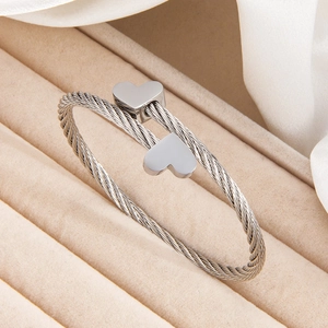 Minimalist silver twist cable heart cuff bracelet in polished stainless steel for women
