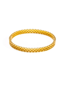 Macro detail of 18k gold plated hollow grid mesh bracelet with watch strap style texture