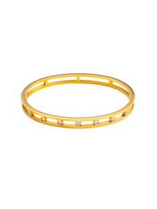 Detailed close-up of 18k gold-plated stainless steel hollow bracelet with inset diamonds