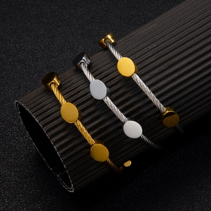 18k gold plated stainless steel cable bangles in gold, silver, and two-tone finishes