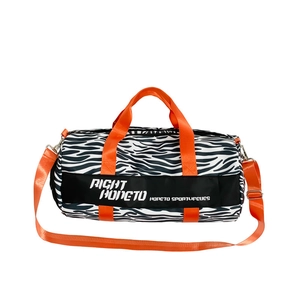 Zebra print large travel duffel bag with bright orange handles and shoulder strap