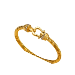Twisted cable 18k gold plated open bangle featuring hook clasp and crystal accents