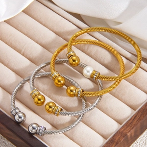 Set de 3 bracelets torsadés en acier titane avec perles et diamants en or et argent