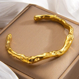 Modern irregular C-shape open cuff bracelet in 18k gold plated stainless steel