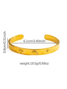 Detail of retro hammered gold bangle with star embossing and size specifications