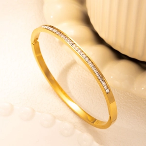 Golden titanium steel bangle with rectangular cubic zirconia and Roman style open design