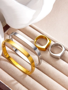 Flat irregular square bangles and geometric rings in gold and silver finish set