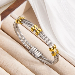 Luxury twisted steel cable bracelet with gold H-shaped buckles and inset diamonds