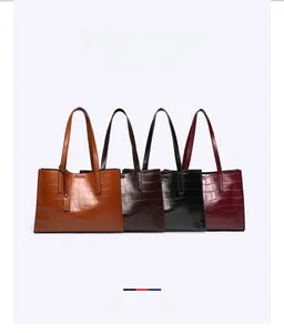 Selection of crocodile pattern tote bags in brown, coffee, black, and red leather