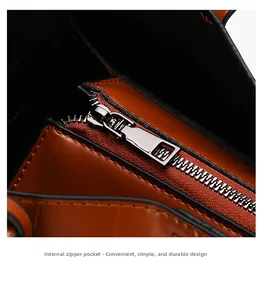 Detailed close-up of the internal zipper pocket and smooth lining of the brown leather bag