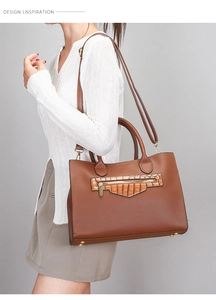 Detail of lychee pattern leather tote with crocodile texture stitching and metal feet