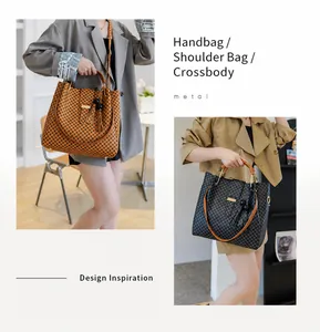 Detail of checkered tote bags with tassel charms showing handheld and shoulder carry styles