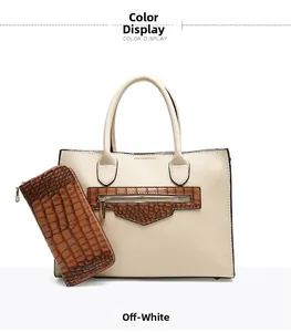 Detail view of off-white tote bag and brown crocodile embossed wallet set