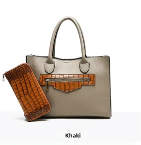 Macro shot of khaki lychee leather tote and brown crocodile pattern wallet set