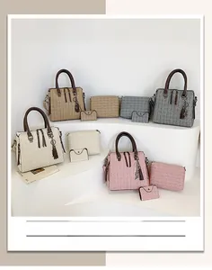 Detailed set of embossed tote bags with matching pouches and stylish tassel charm