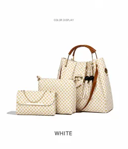 Three-piece women bag set featuring a white tote with yellow polka dots and metal accents