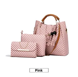 Detailed view of pink 3-piece bag set with tote, crossbody bag and gold chain clutch
