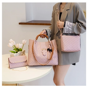 Detailed set of three pink checkerboard bags including large tote, crossbody, and clutch