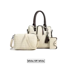 Close-up of three-piece tote set in off-white tweed fabric with dark brown trim