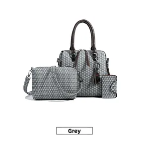 Three-piece grey handbag set featuring woven texture, leather trim and a tassel charm