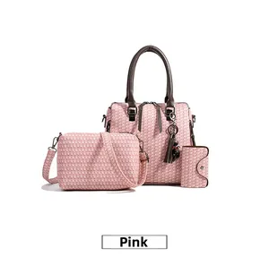 Detailed set of pink tweed texture handbag with shoulder bag and clutch including tassel detail