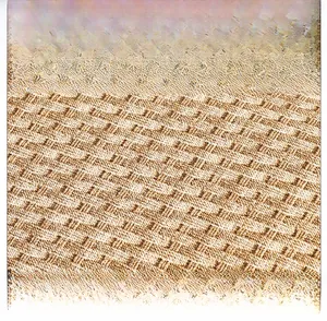 Detailed macro view of woven herringbone texture in beige and light brown synthetic fibers