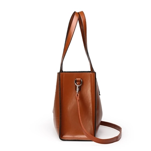 Brown crocodile pattern faux leather tote bag with dual handles and long shoulder strap