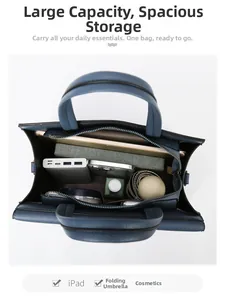 Spacious blue leather tote bag interior with compartments for iPad and accessories