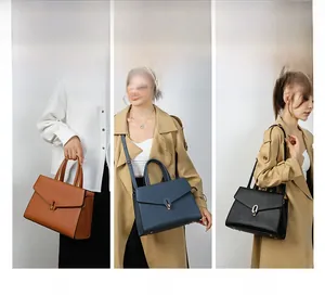 Three-way bag showing hand-held, crossbody and shoulder styles in textured leather
