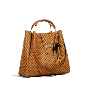 Women's vintage camel tote bag with geometric dot prints and black tassel charm