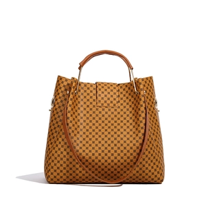 Brown monogram tote bag with leather handles and adjustable shoulder strap for women