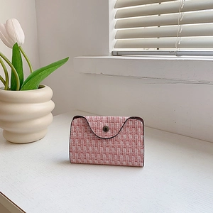 Red and white tweed envelope clutch bag with metal button closure and floral decoration