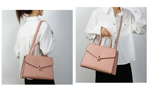 Litchi texture leather handbag in sakura pink featuring a golden oval metal lock detail