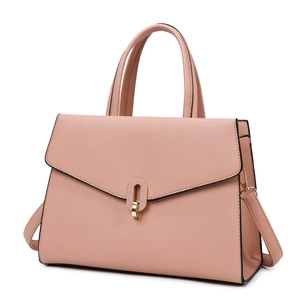 Dusty rose leather handbag with gold oval buckle and detachable shoulder strap on white background