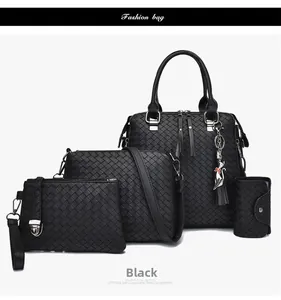 Dettaglio del set da 4 borse nere intrecciate con tracolla, pochette e porta carte