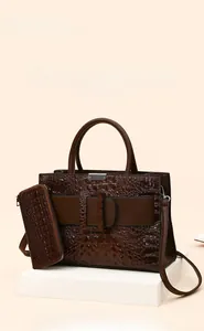 Detail of dark brown crocodile embossed tote bag set with matching long zipper wallet