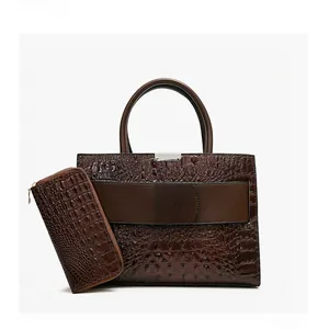 Front view of a dark brown crocodile pattern handbag set with matching long wallet